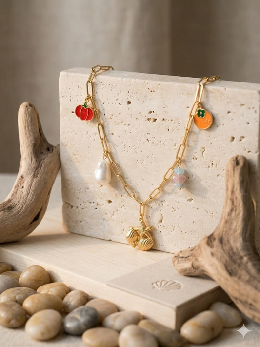 Gold charm necklace paired with beachwear for a boho summer vibe